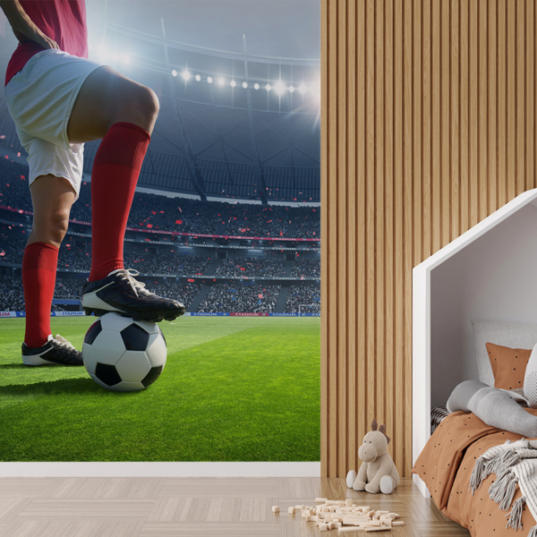Fototapet Fotbollsspelare på gräset